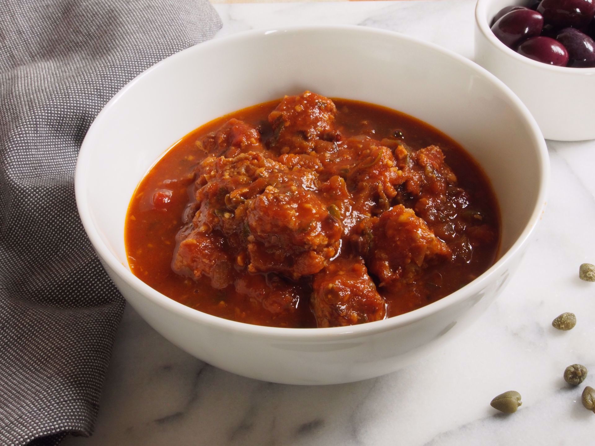 Picture of Chicken Meatballs with Broth-Based Puttanesca Sauce -- 16 oz